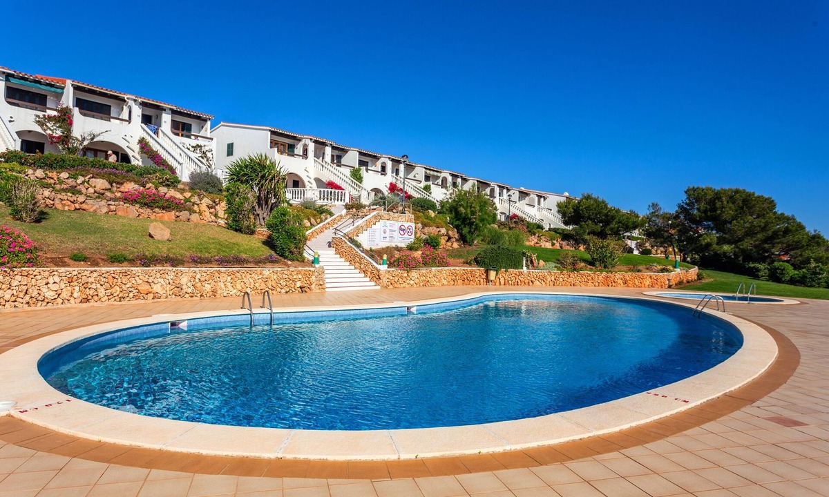 Arenal d'en Castell Apartment | Apartment 'Arenal De'n Castell' with Sea View, Shared Pool and Wi-Fi