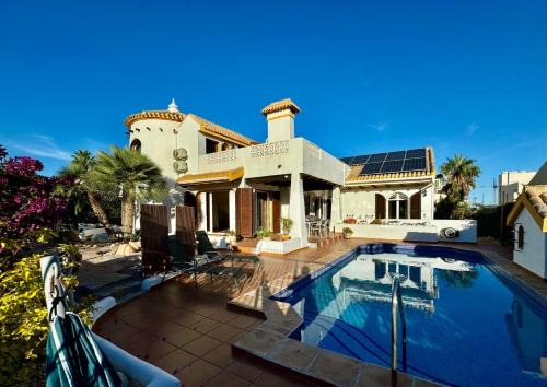 Villamartin Villa | Ibiza style villa first line to golf!