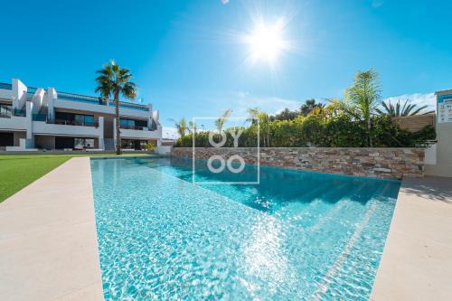 San Pedro del Pinatar Apartment | La Llana penthouse oasis with rooftop kitchen and pool - by OYOOSTAYS