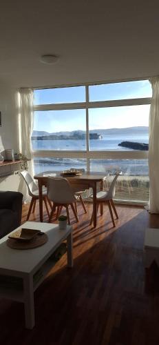 Carino Apartment | Piso primera línea de playa y vistas al mar en Cariño