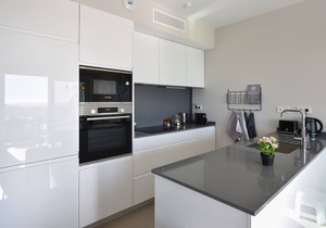 Stylish apartment in luxury resort with gym, pool, garage. Sea view!