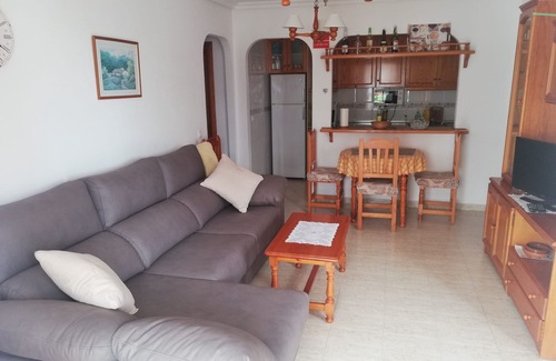 Vera Beach Apartment | Living room with balcony and sea view, waterfront and south-facing