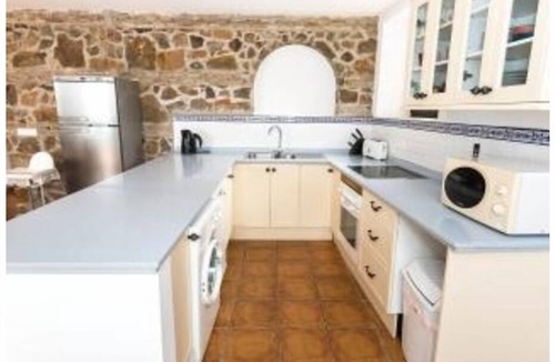 Malaga-Este Apartment | 17th century convent offering family holidays with pool, tennis & amazing views