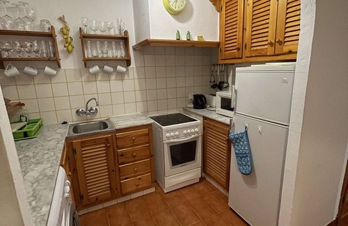 Arenal d'en Castell Apartment | 2 bedroom Apartment With Pool, Shared Gardens And Sea Views