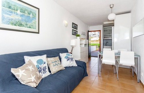 Arenal d'en Castell Apartment | Apartment 'Arenal De'n Castell' with Sea View, Shared Pool and Wi-Fi