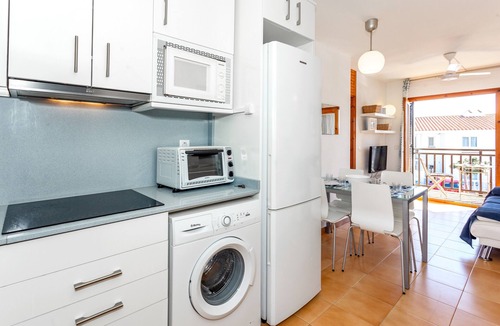 Arenal d'en Castell Apartment | Apartment 'Arenal De'n Castell' with Sea View, Shared Pool and Wi-Fi
