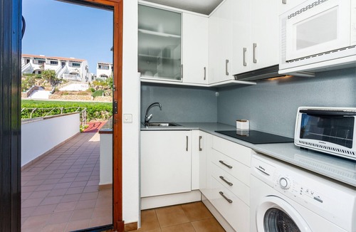 Arenal d'en Castell Apartment | Apartment 'Arenal De'n Castell' with Sea View, Shared Pool and Wi-Fi