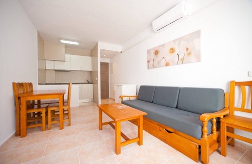 Santa Eulalia del Rio Apartment | Apartment Ses Veles 2 dormitorios close to the Beach with Sea View, Pool, Wi-Fi & Garden