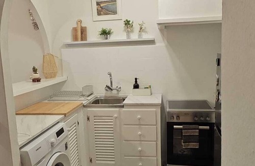 Arenal d'en Castell Apartment | Apartment with Private Pool, Garden and Sea Views