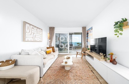 Punta Prima Apartment | Beachfront Bliss apt, with heated pool, by OYOOSTAYS