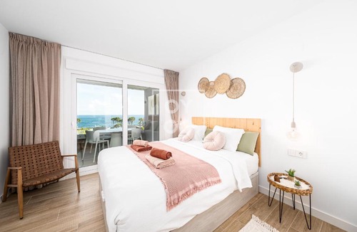 Punta Prima Apartment | Beachfront Bliss apt, with heated pool, by OYOOSTAYS