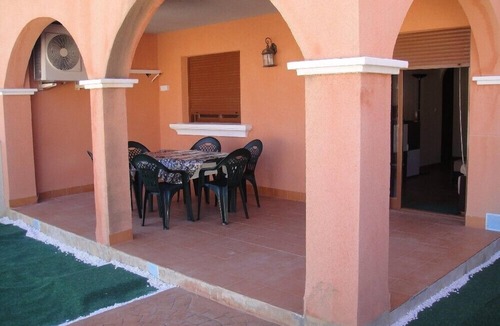 Los Puertos Apartment | Beautiful apartment 500 m from the beach with private garden and sea views