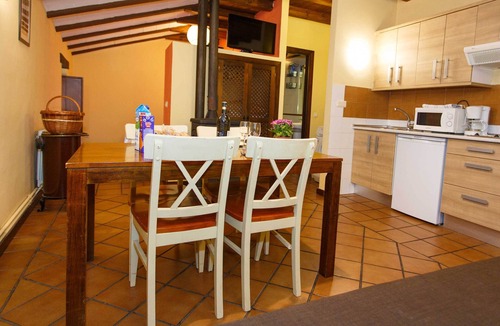 Robregordo Ski Chalet | Comfortable bedroom apartment sofa bed and fireplace on the first floor