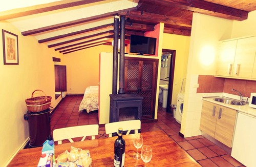 Robregordo Ski Chalet | Comfortable bedroom apartment sofa bed and fireplace on the first floor