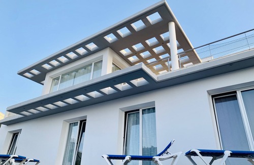 Binisafua Villa | Modern luxury villa with pool and stunning sea views.