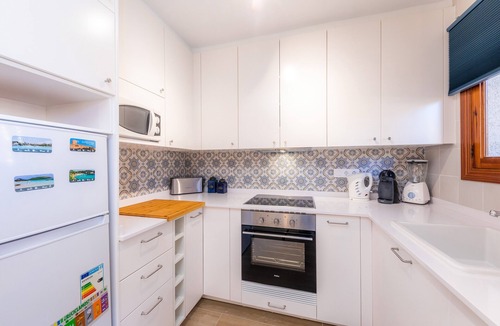 Cala Agulla House | Vacation Home "Can Nogueras" with Wi-Fi, Balcony, Terrace, Shared Pool and Garden