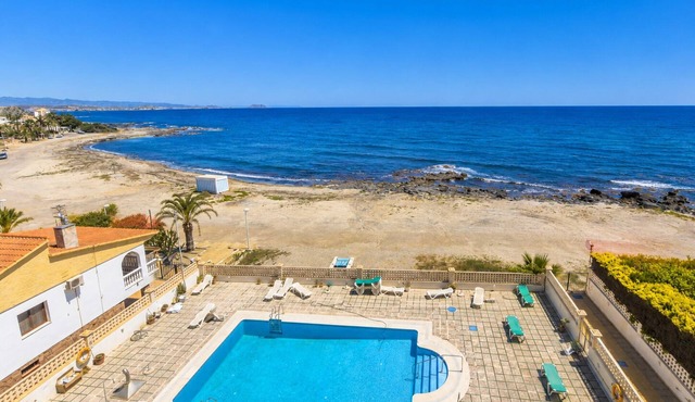 Andalusia, beachfront apartment, pool, terrace, parking.