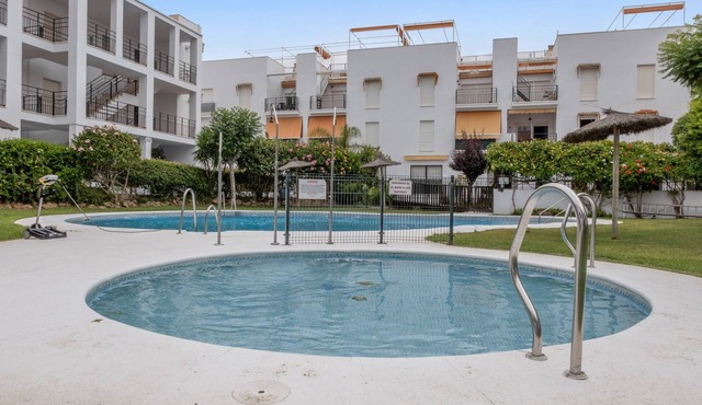 Apartment 'Golf Y Costa' with Shared Pool, Wi-Fi and Air Conditioning