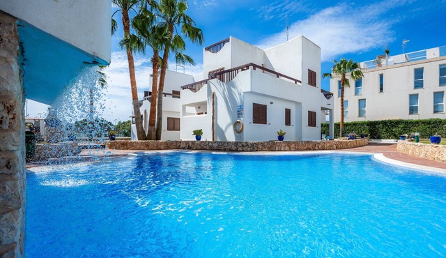 Apartment La Perla de Cala d'Or 8 with Shared Pool, Garden & Wi-Fi