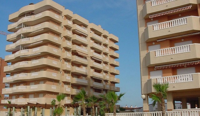 Beachfront Apartment with Pool, 2 Bedrooms, Terrace, and Parking