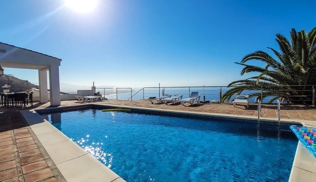 Luxury villa with heated pool and sea views.