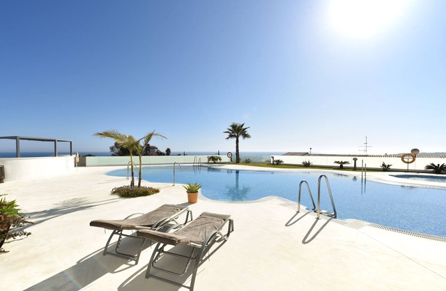 Stylish apartment in luxury resort with gym, pool, garage. Sea view!
